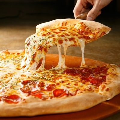 Pizza is a savory dish made of dough, sauce, toppings, and baked in an oven